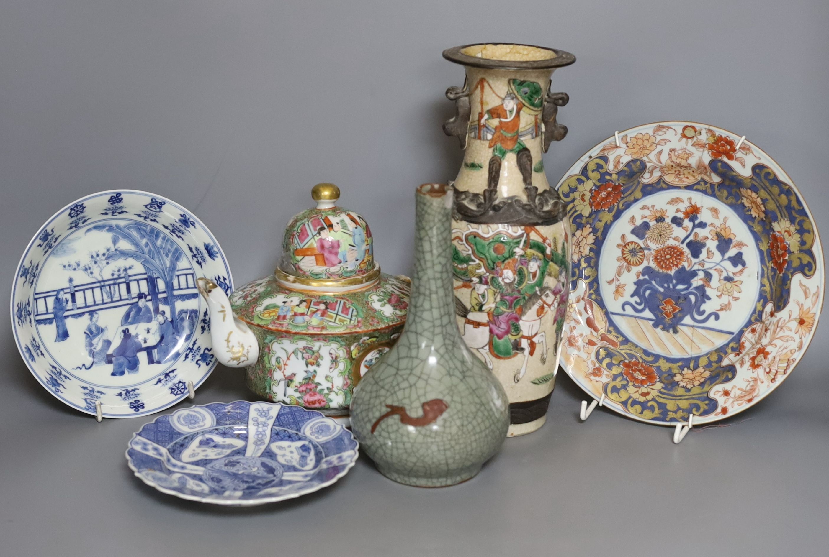 Three Chinese plates including a 19th century Chinese Imari dish, 23cm - repaired, a Chinese famille rose crackleglaze vase, 29cm, together with a famille rose teapot and a crackleglaze celadon ground bottle vase. Talles